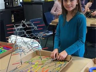 students playing with tinker toys